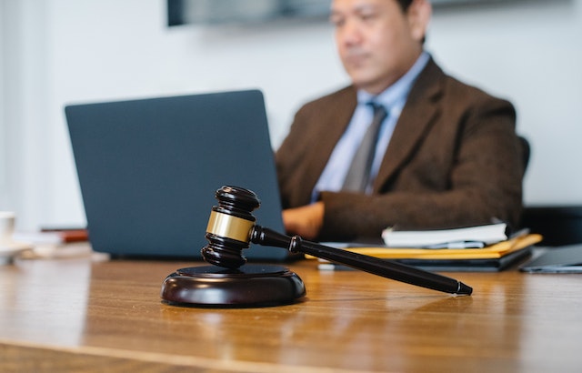 lawyer%20sitting%20at%20desk lawyer%20sitting%20at%20desk